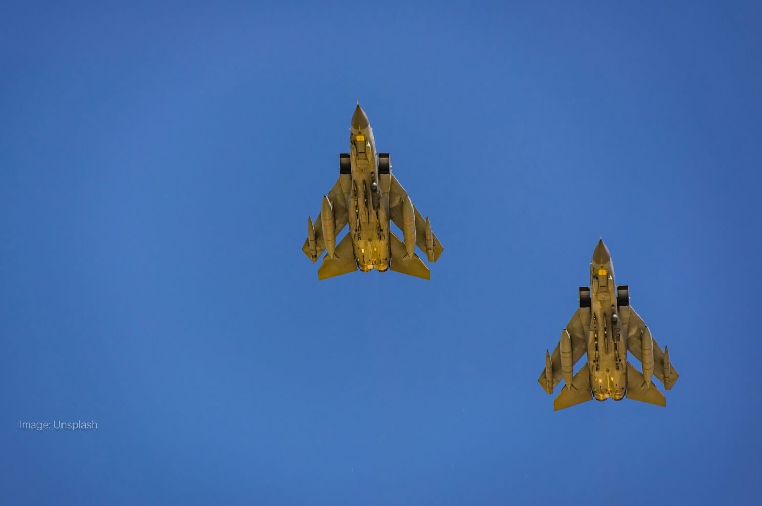 two-jets-flying-across-blue-sky.jpg