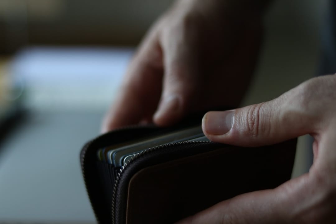 hands-opening-wallet-close-up.jpg