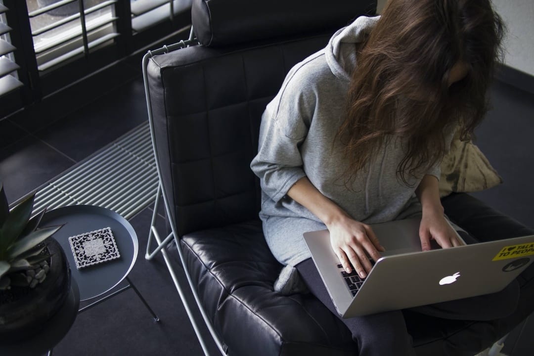 person-sitting-on-black-chair-with-laptop.jpg