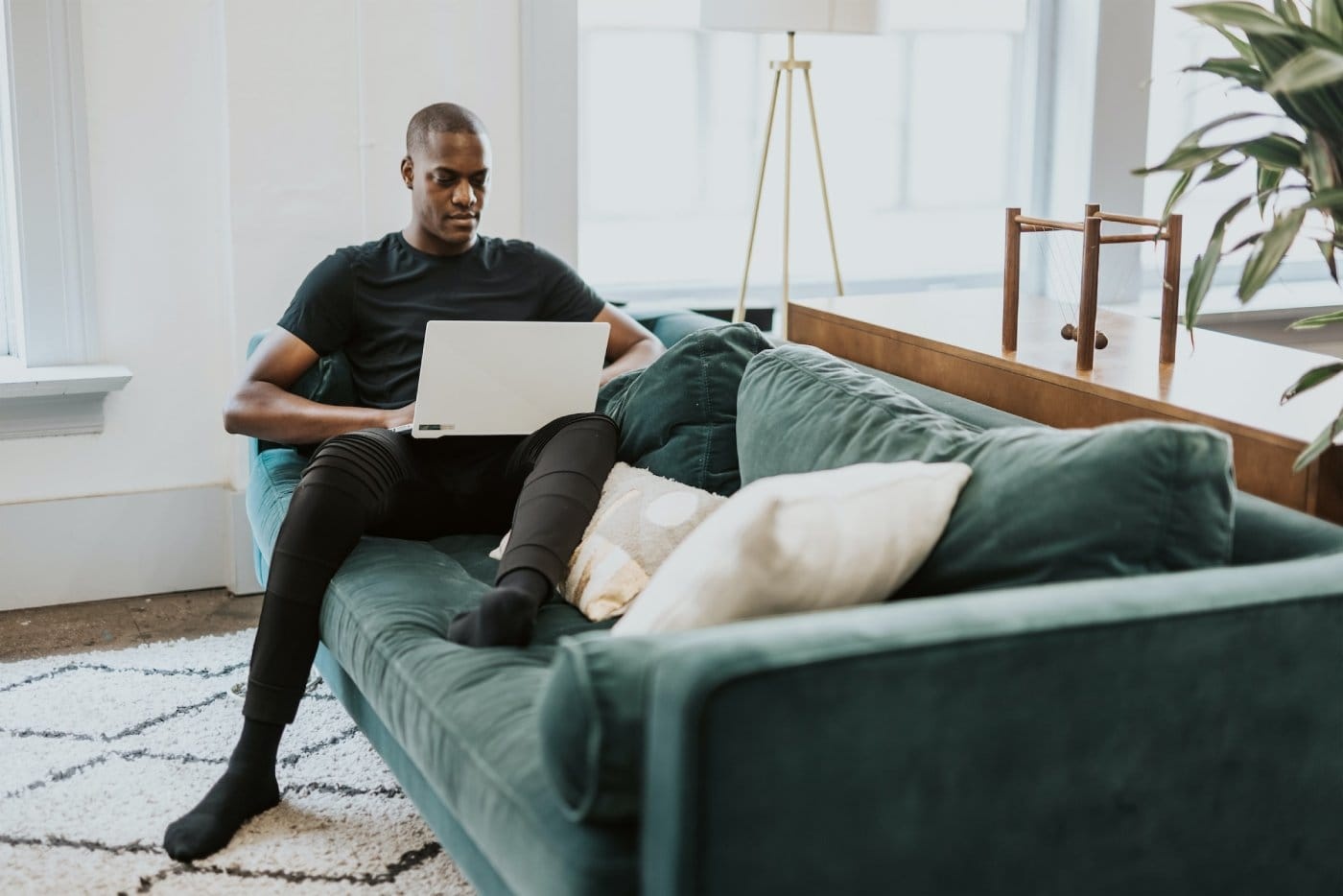 person-sitting-on-lounge-with-laptop.jpg