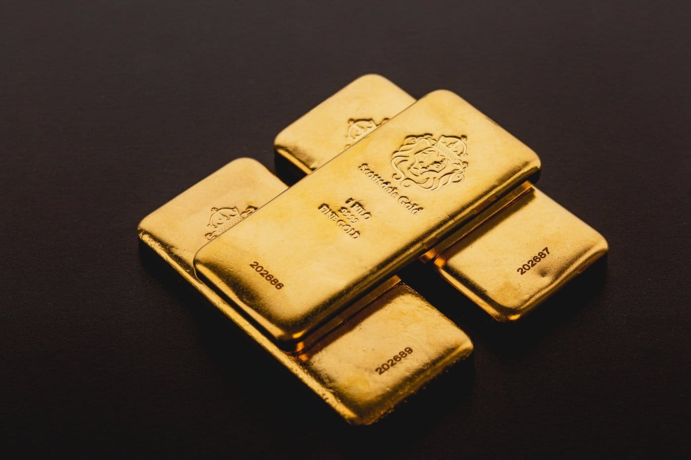 physical-gold-bars-black-background.jpg