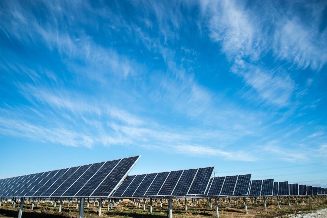 solar-panel-farm-with-bright-blue-sky.jpg