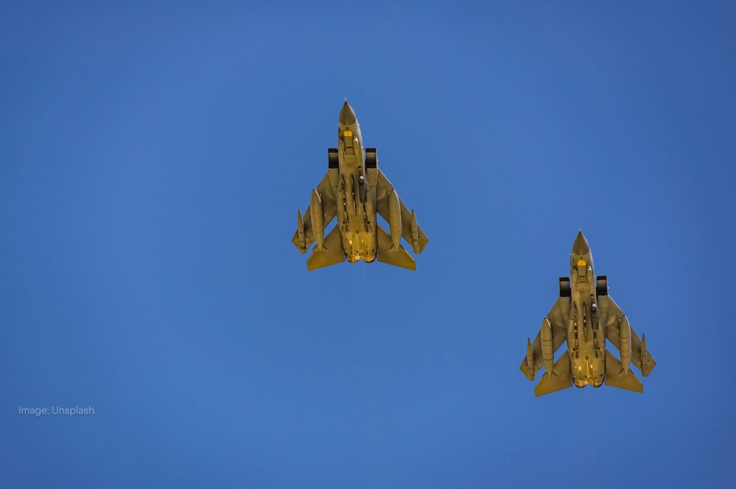 two-jets-flying-across-blue-sky.jpg