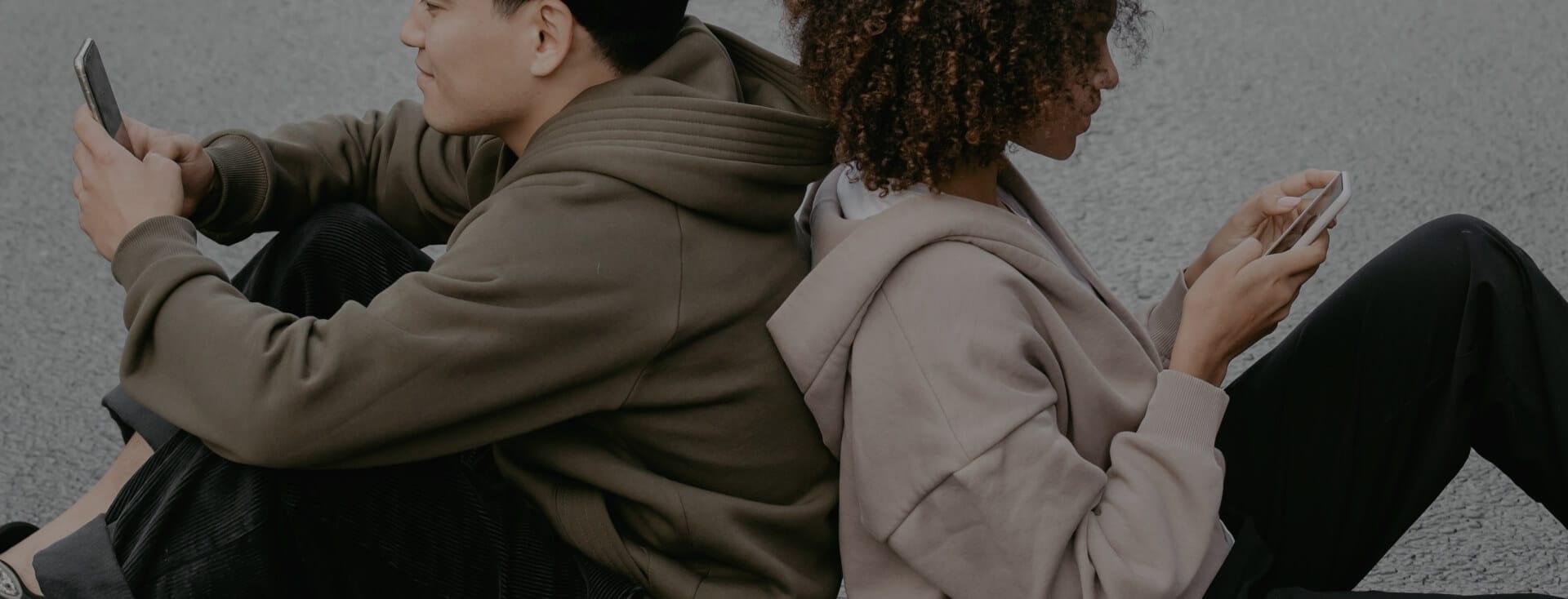two-people-on-phones-backs-together.jpg