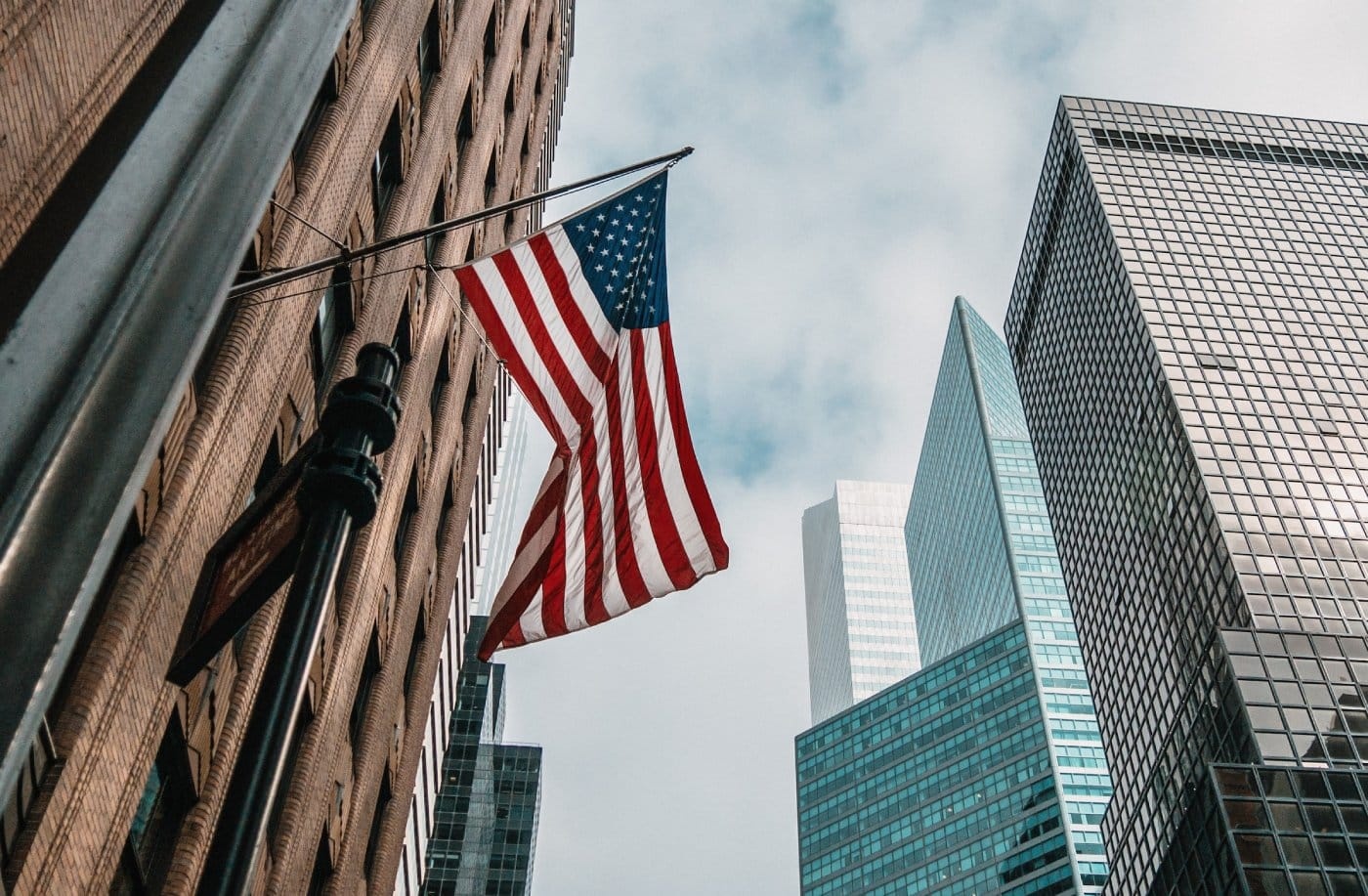 usa-flag-on-side-of-building-new-york-blue-chip-stocks.jpg