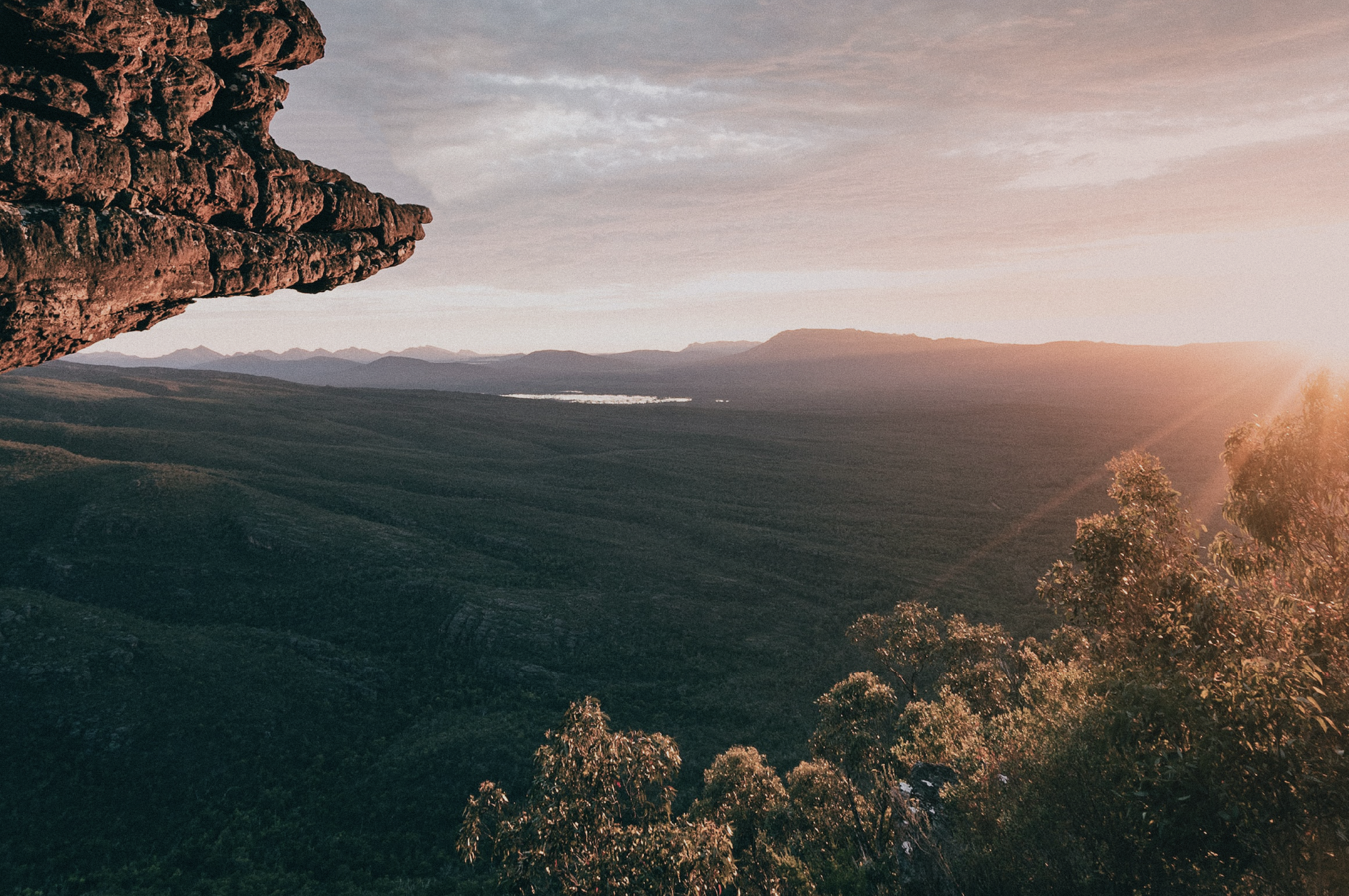 An Australian landscape as the sun rises on a clear day.