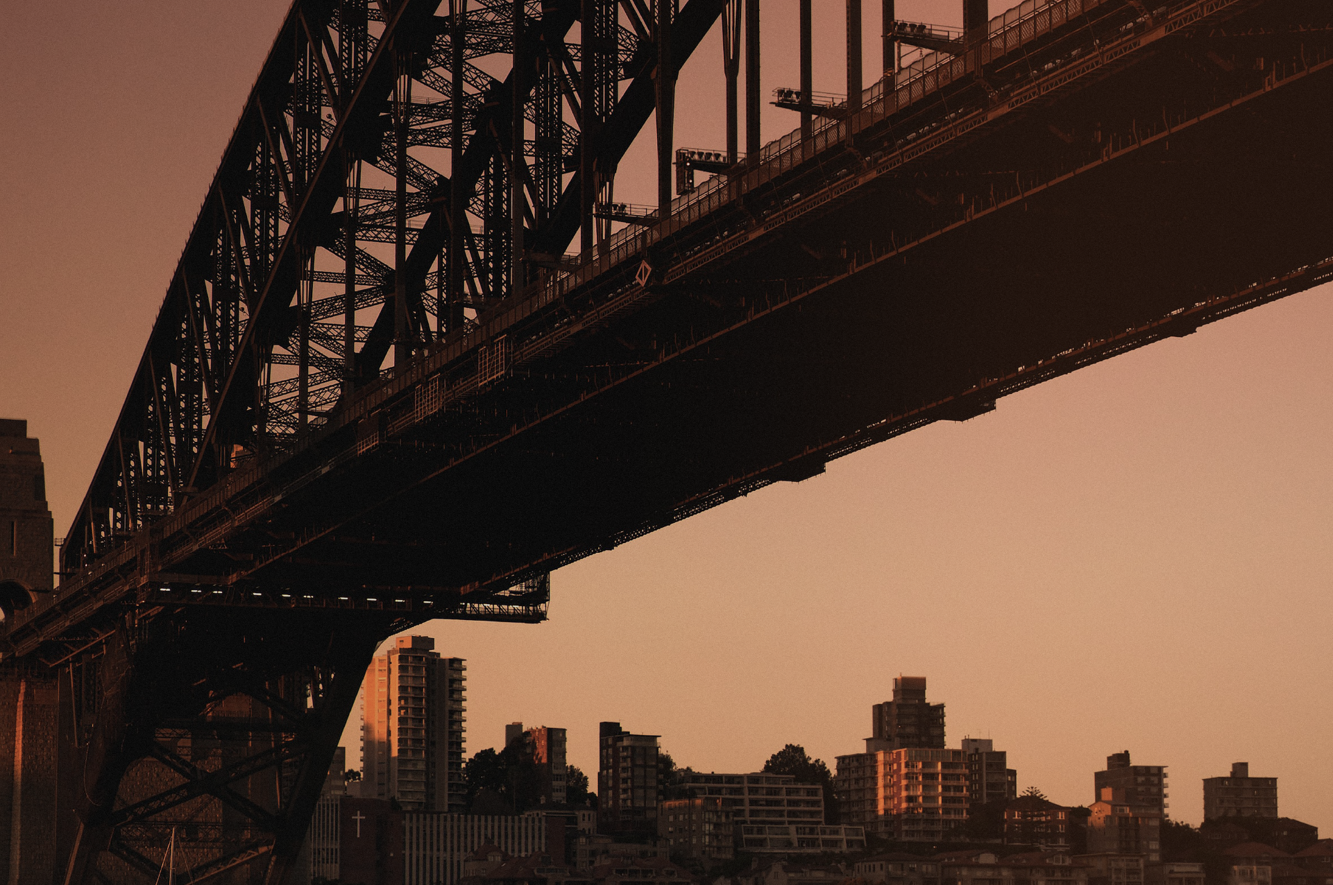 The Sydney Harbour Bridge during sunset looking back over the North Shore