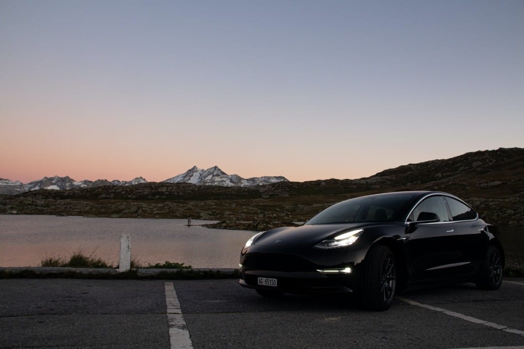 black-tesla-model3-mountain-in-background.jpg